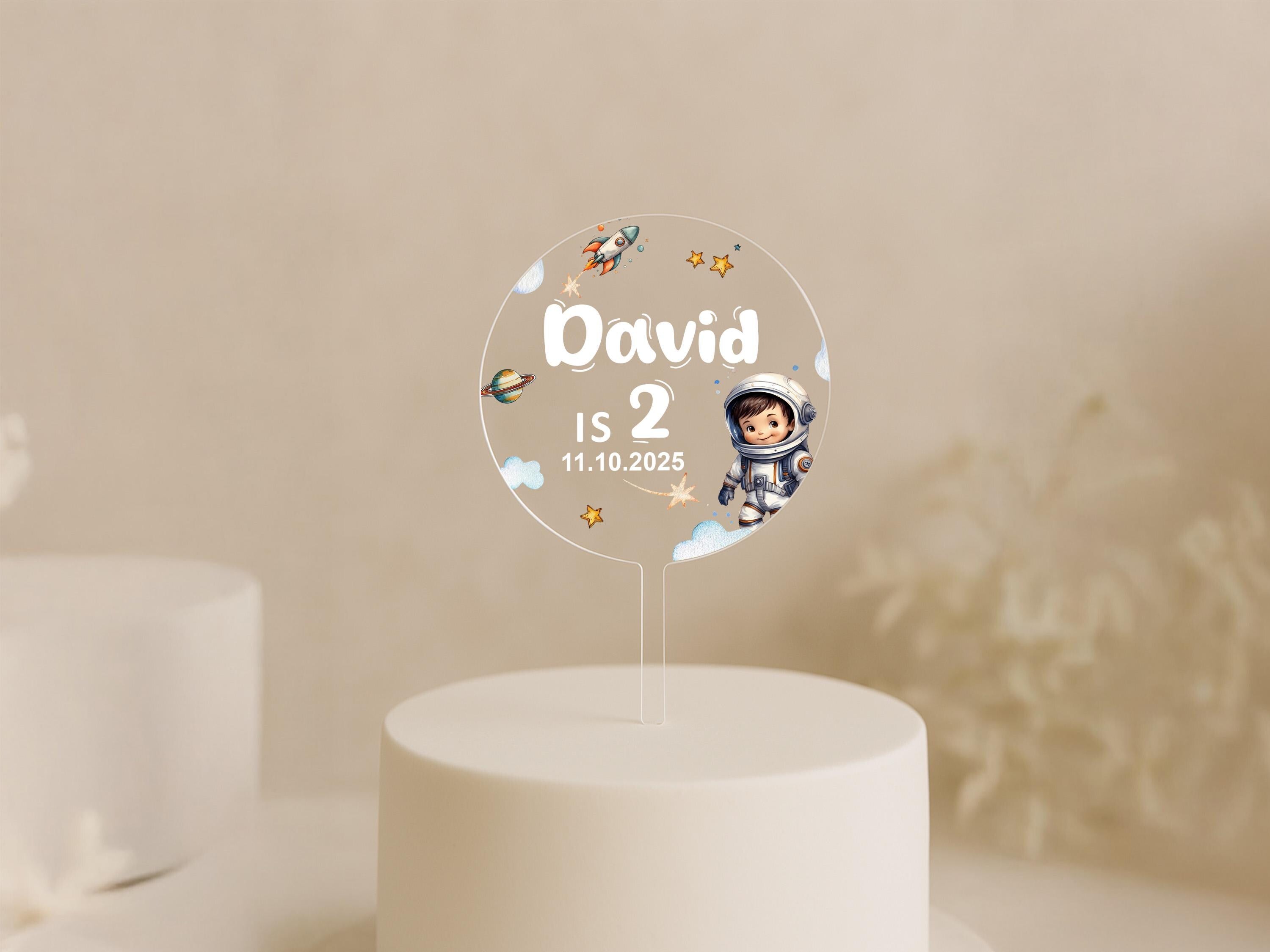 a white cake with a cake topper on it