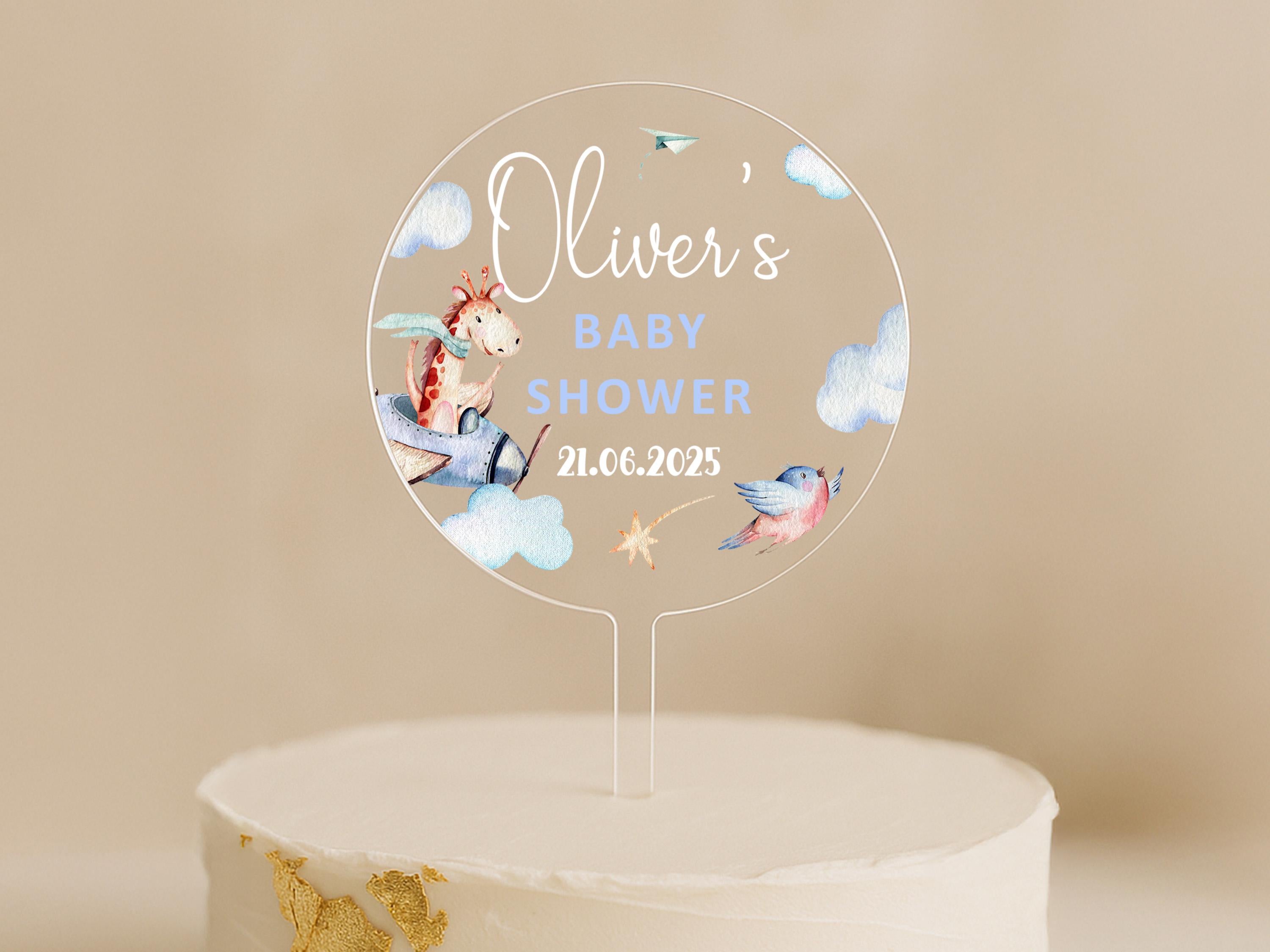 a cake with a baby shower sign on top of it