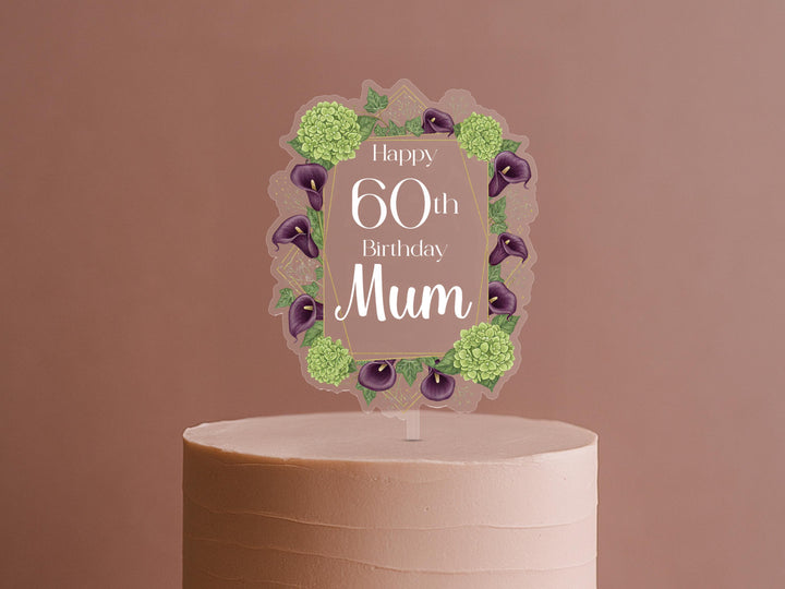 A cake topper with a floral design and text that reads &quot;Happy 60th Birthday Mum&quot;.