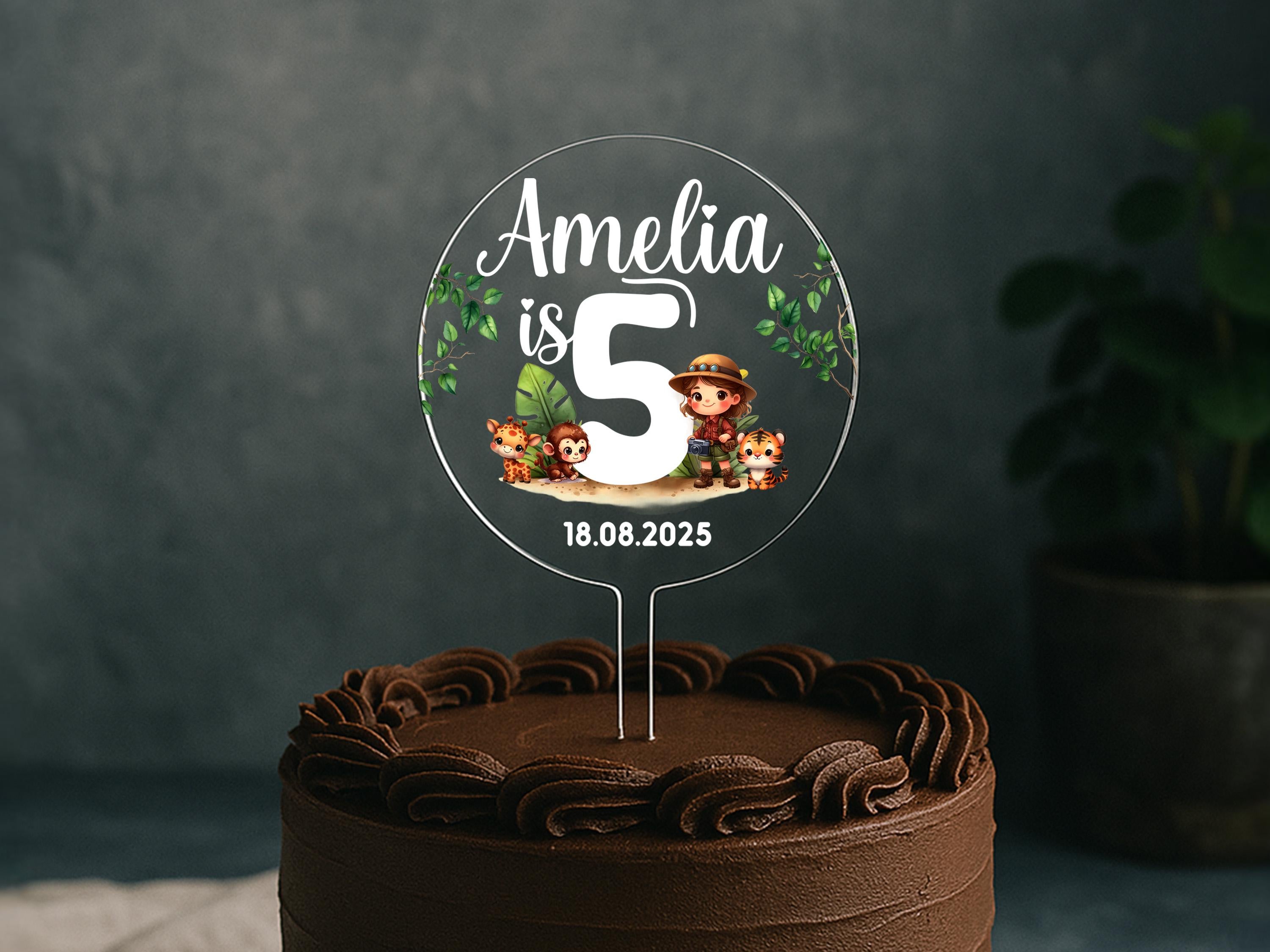 Jungle party cake with personalised name and age topper