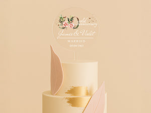 a three tiered wedding cake with pink and gold decorations