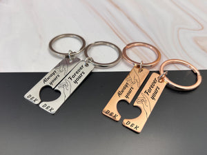 Rose gold custom couple keyrings, engraved with hands touching and personalised names or initials.