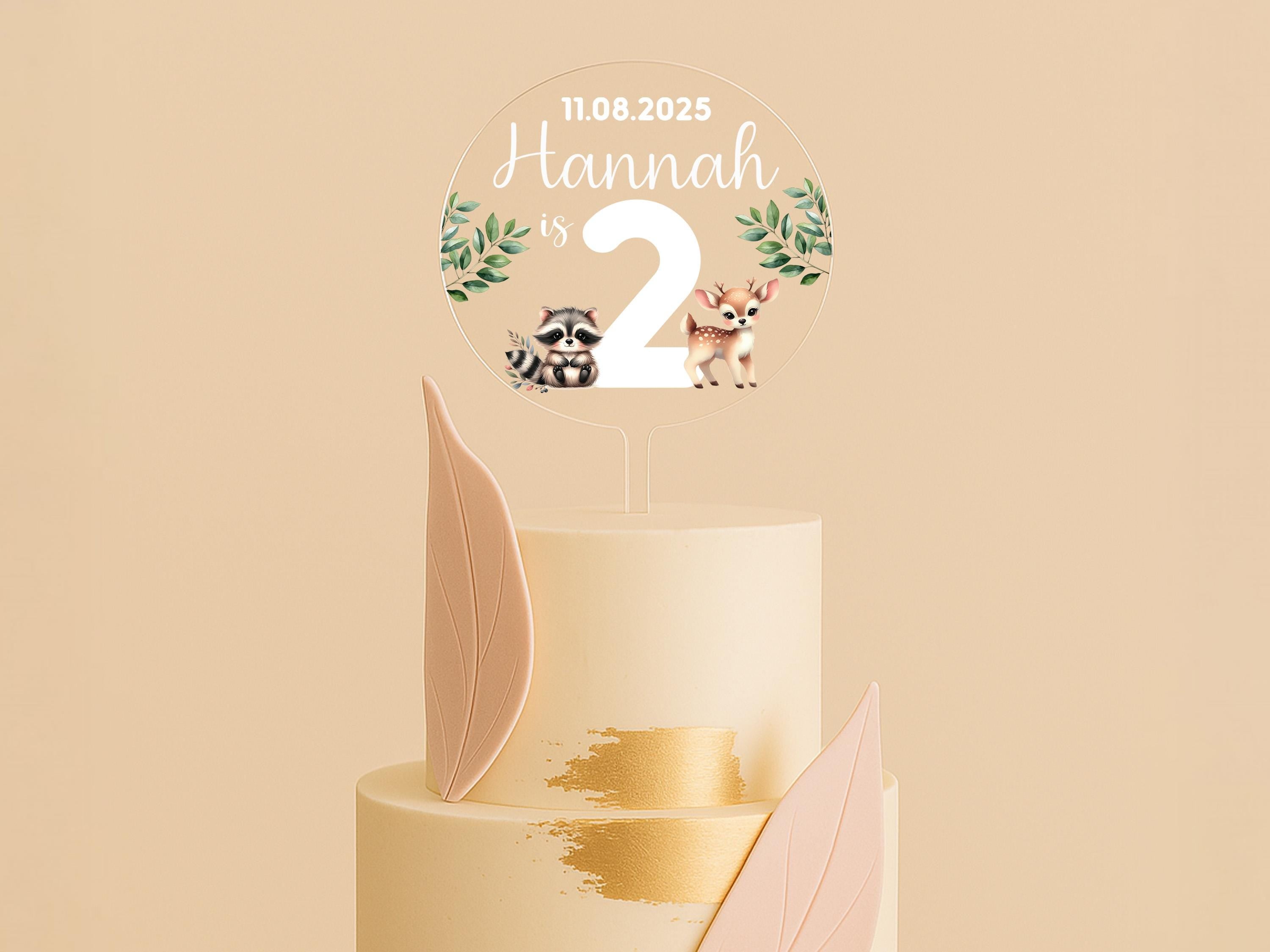 a three tiered cake with a topper on it