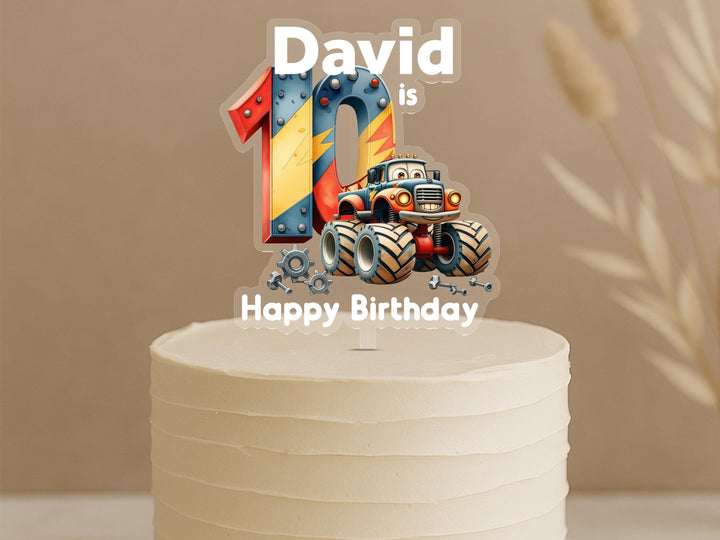 Personalised monster truck birthday cake topper showing number 10 with detailed truck, big wheels, gears and custom name David on white cake