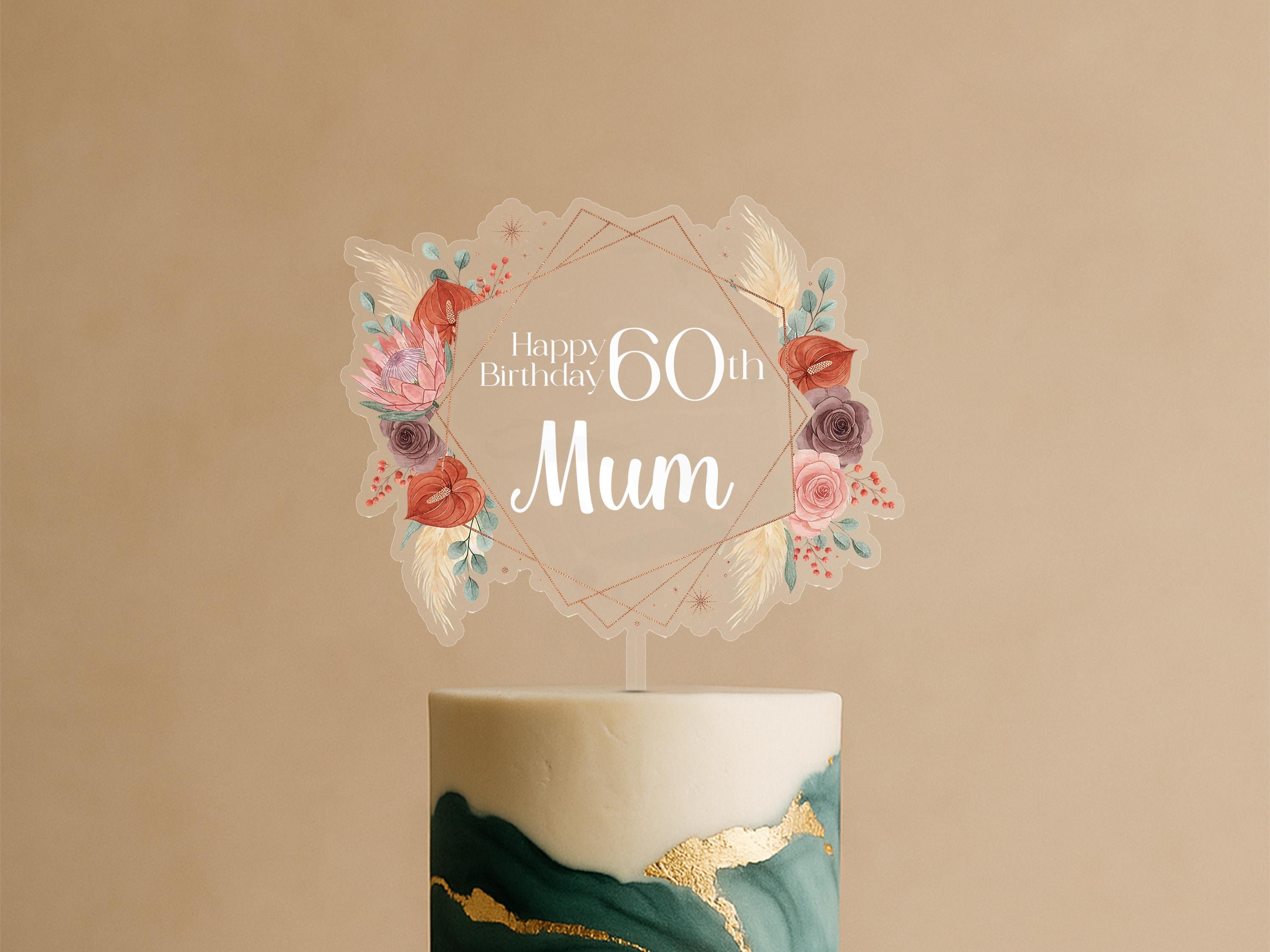 A birthday cake with a decorative topper that says "Happy Birthday 60th Mum".