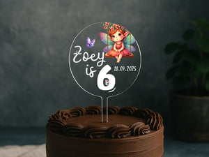 a birthday cake with a picture of a fairy on top