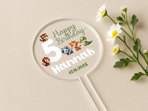 a birthday sticker on a table next to a flower