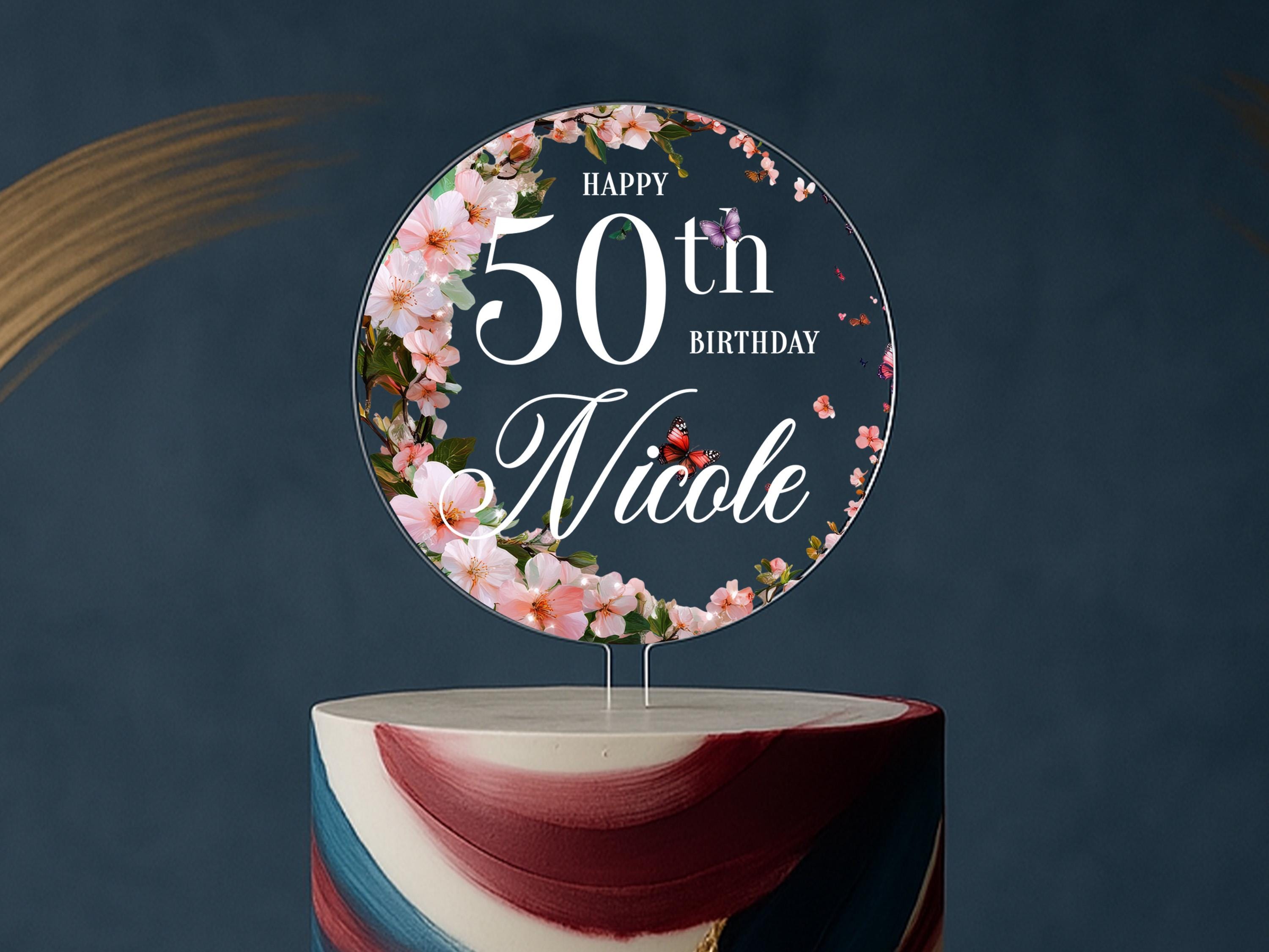 a birthday cake with a floral design on top