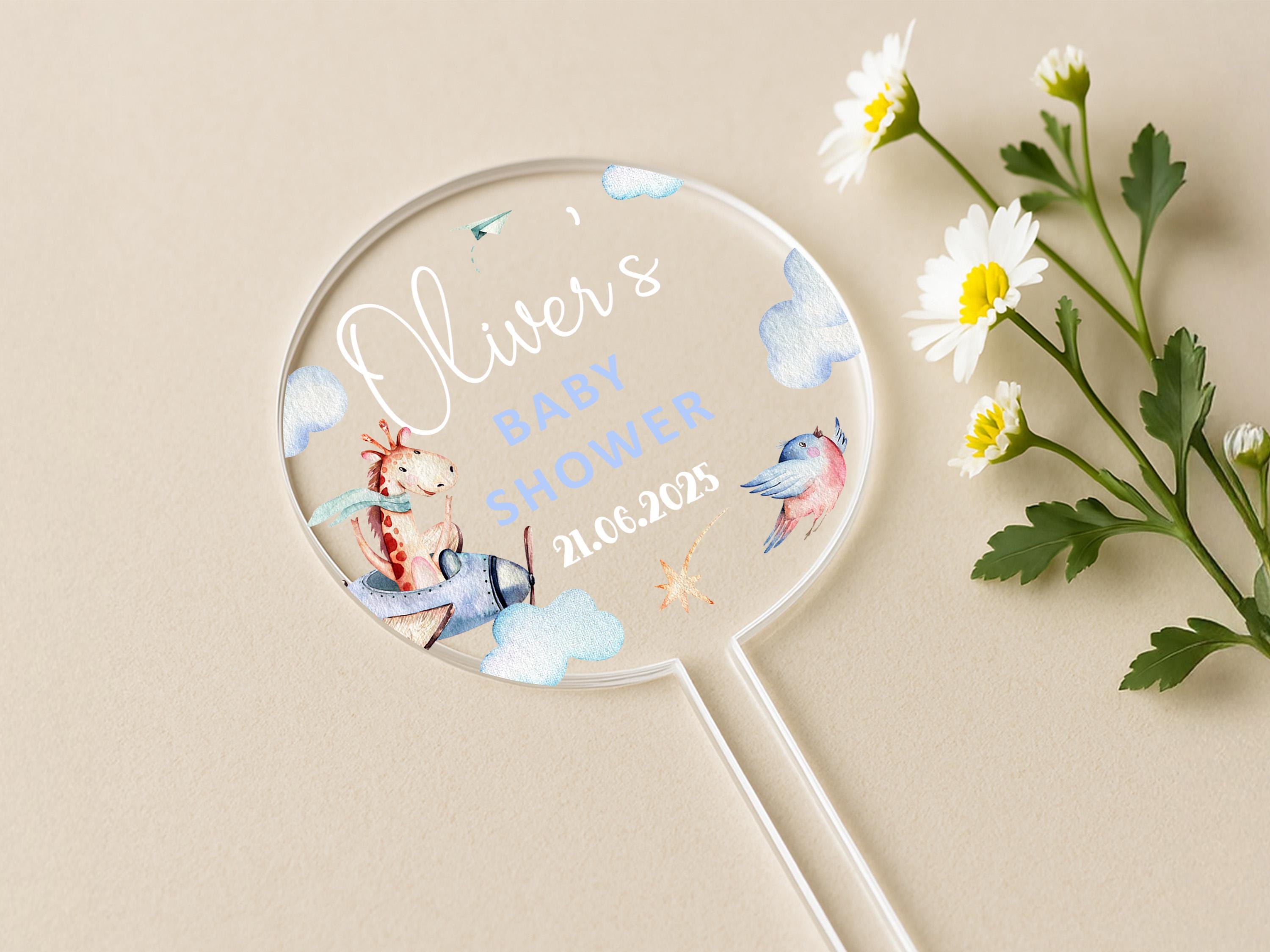 a personalized mirror next to flowers on a table