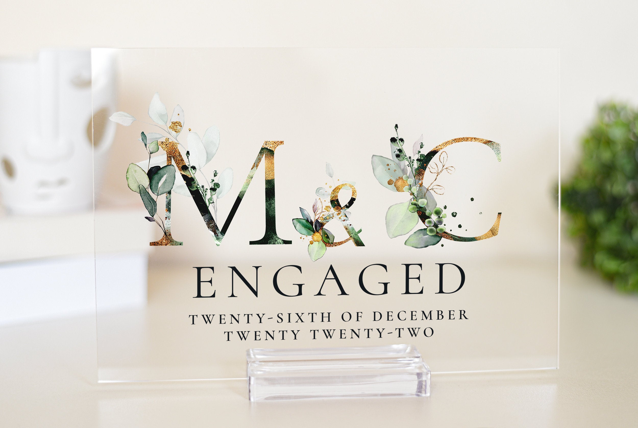 This elegant acrylic plaque is the perfect personalised gift for an engaged couple. Featuring the first letters of the couple's names surrounded by a beautiful floral design, it's a thoughtful and stylish way to celebrate their engagement.