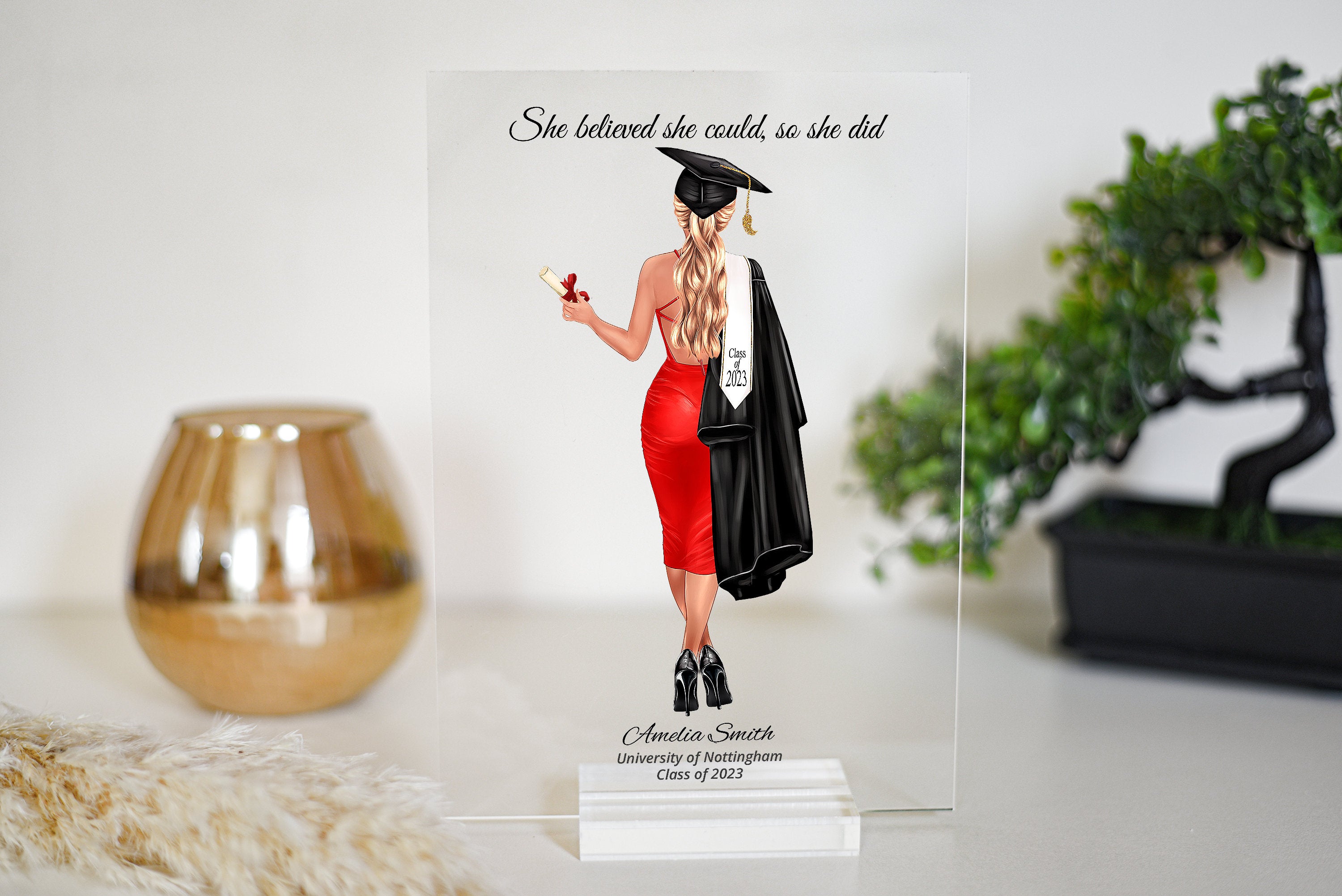 Looking for a unique and personalized graduation gift? Look no further than our custom plaque featuring over 100 dresses and over 250 hair styles! This beautiful and detailed print is the perfect way to celebrate your loved one's accomplishment.
